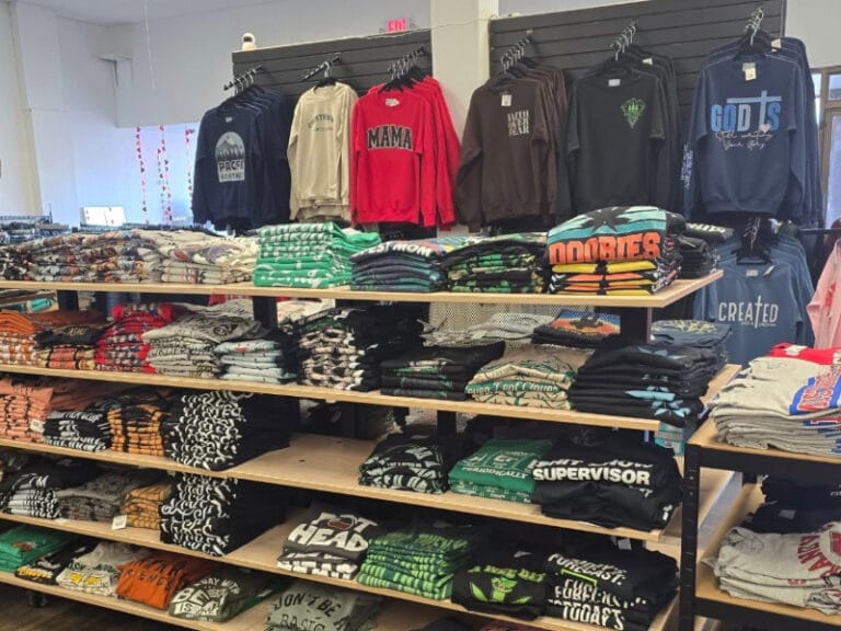 T-shirts on rack and on shelves