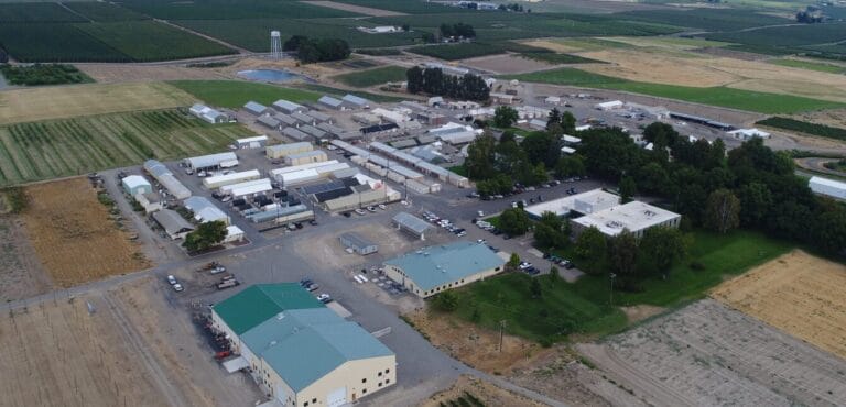 Aerial view of agricultural research facility and farmland.