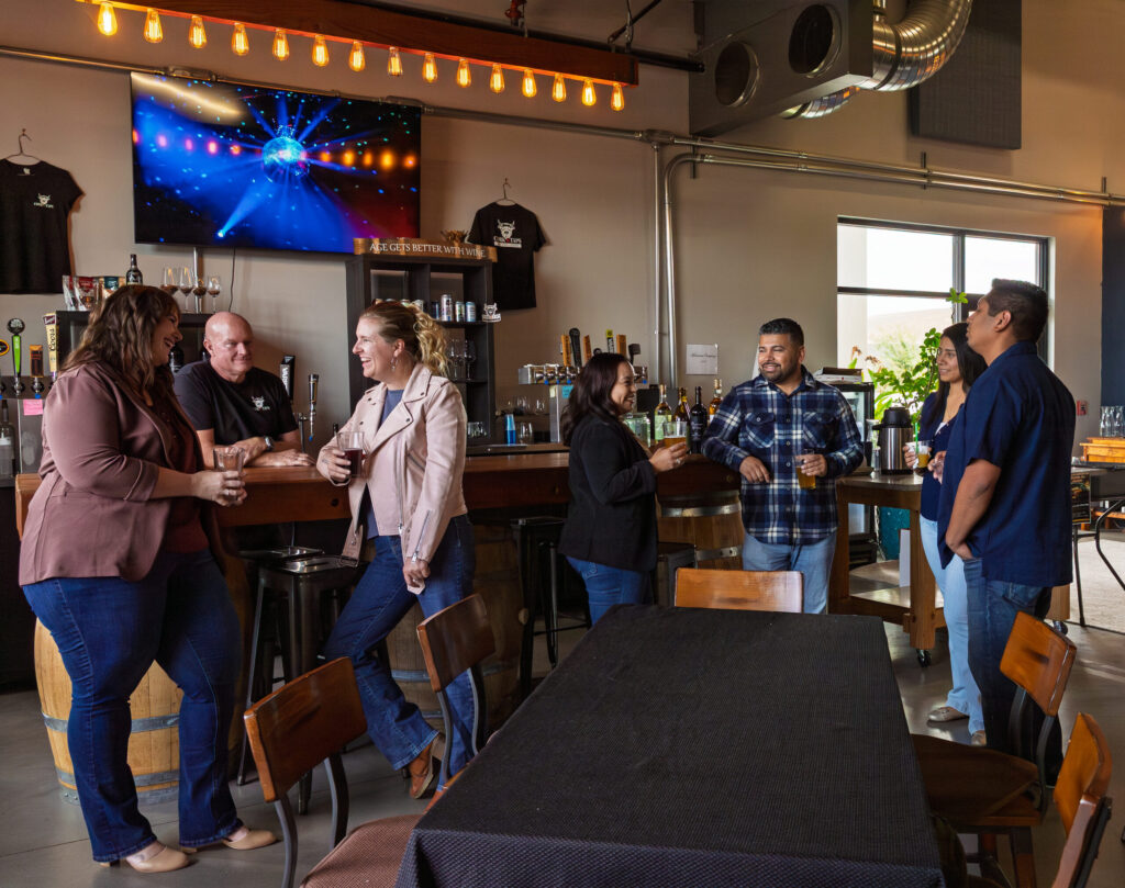 Group socializing at a lively bar gathering.