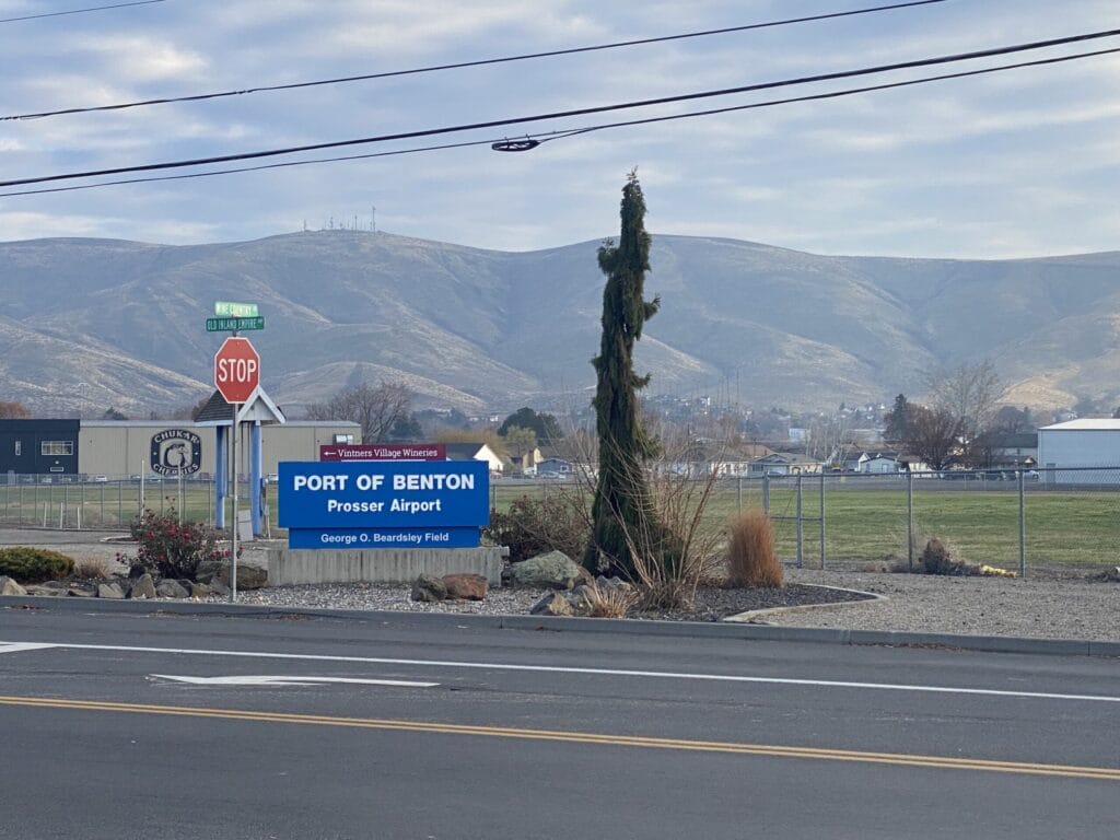 Port of Benton Prosser Airport sign with mountains