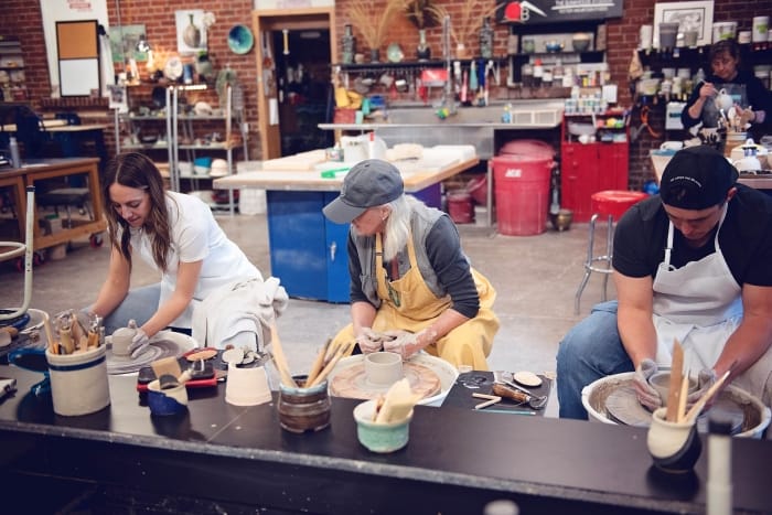 appointmentType-thumb-80434606 People crafting pottery in a studio workshop.
