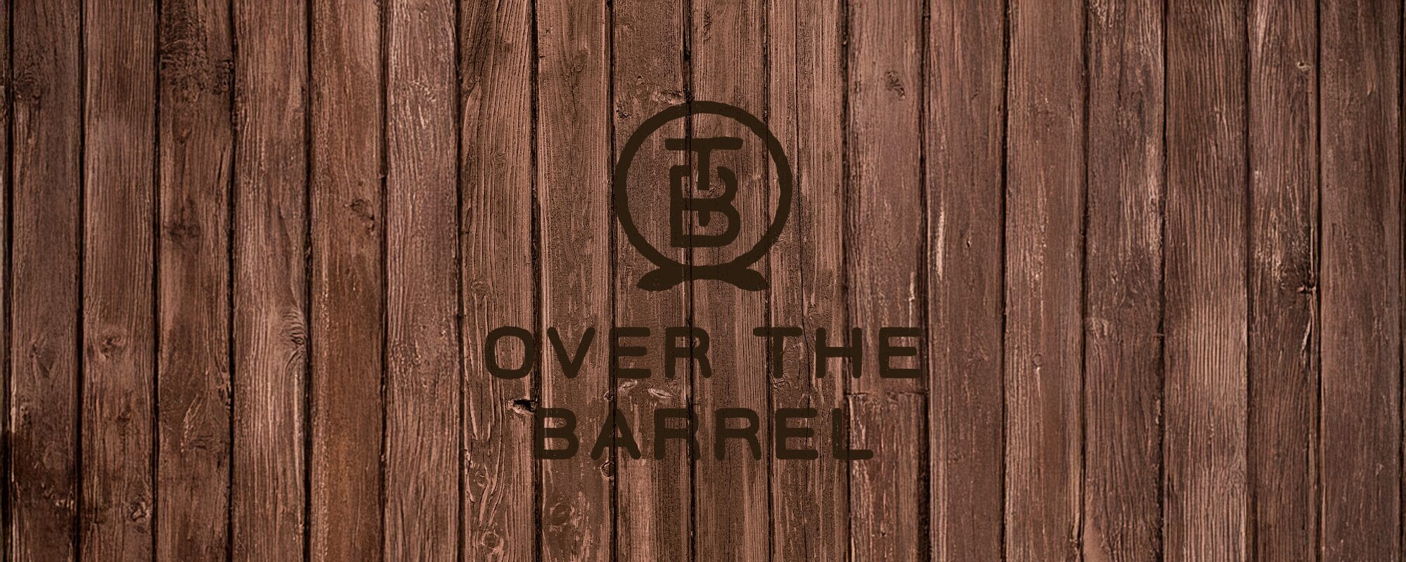image (8) (1) Wooden planks with 'Over the Barrel' logo