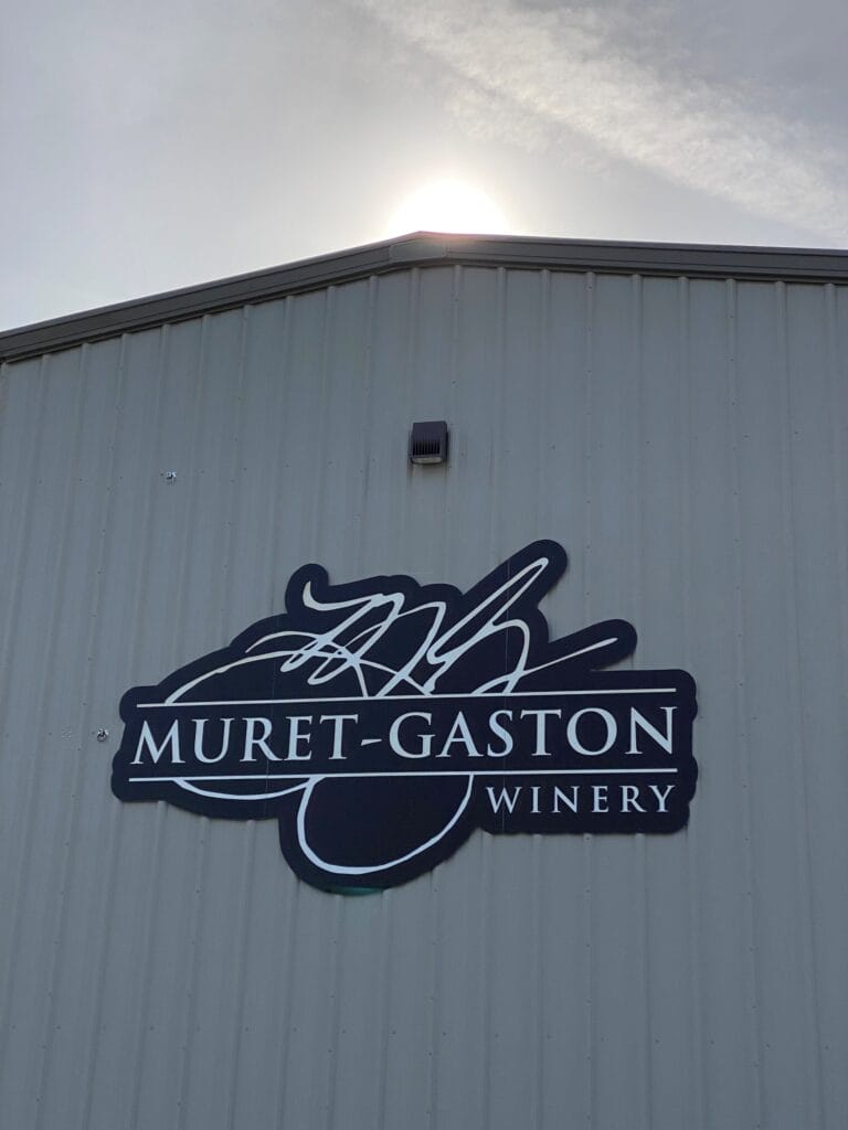 Muret-Gaston Winery sign on building exterior