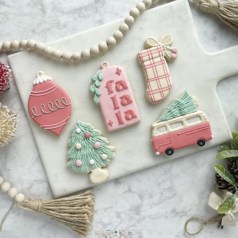 Decorative Christmas cookies on marble board.