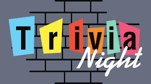 Colorful Trivia Night sign with brick background.