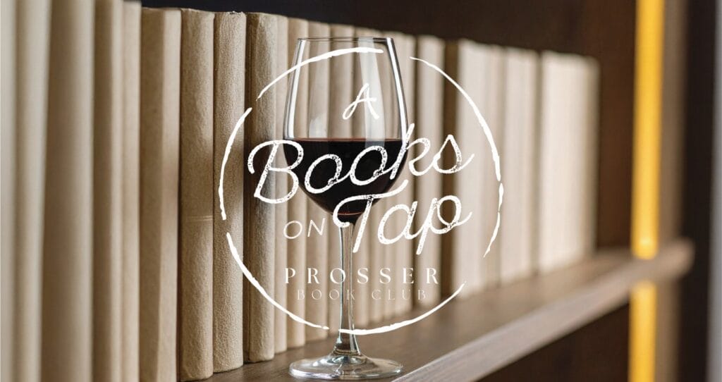 Wine glass in front of a bookshelf.