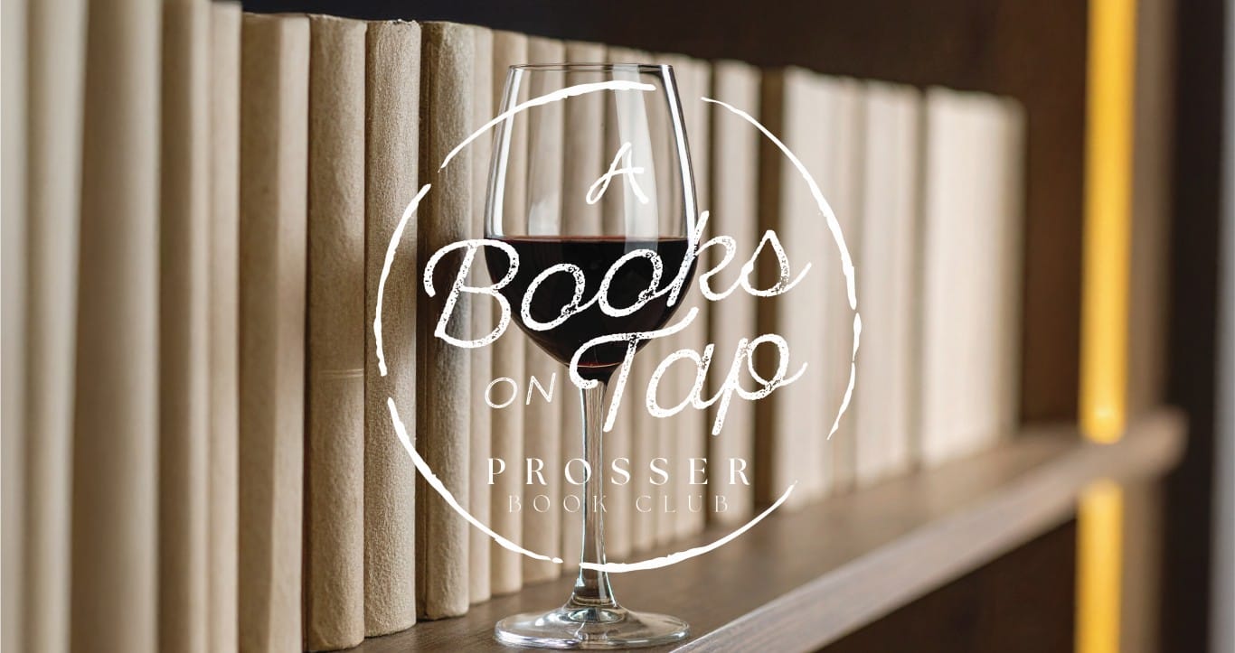 Wine glass in front of a bookshelf.