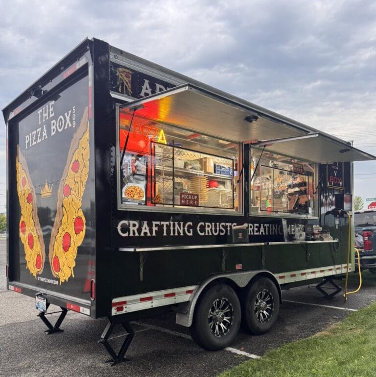 Pizza food truck with open serving window.