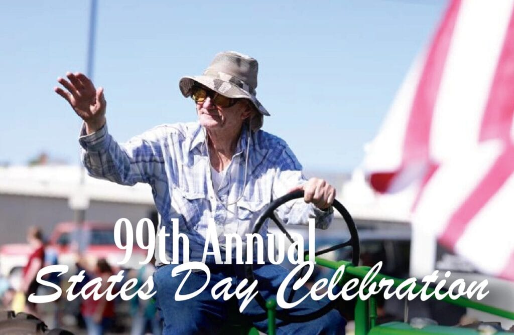 99th States Day Celebration parade participant waving