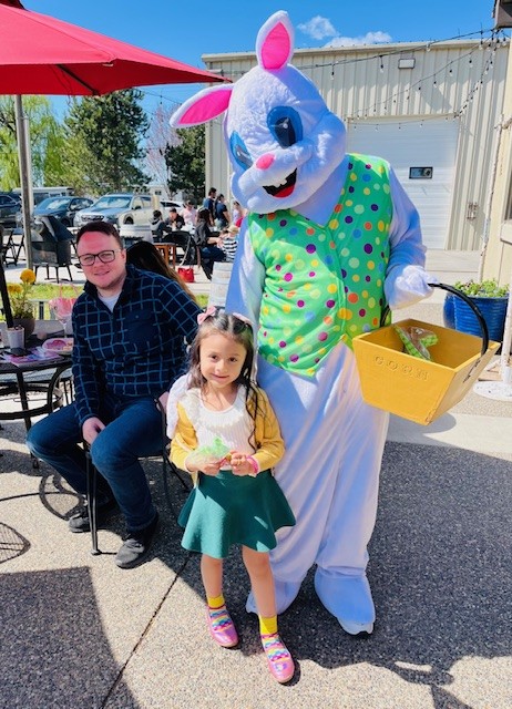 Child and Easter Bunny with gift basket.