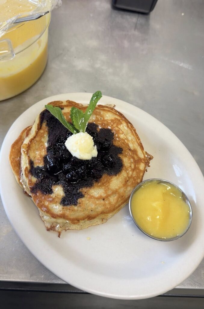 Blueberry pancakes with butter and lemon sauce