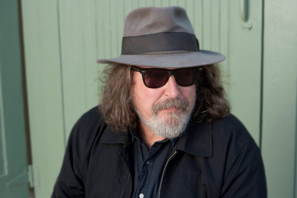 Man with hat and sunglasses portrait
