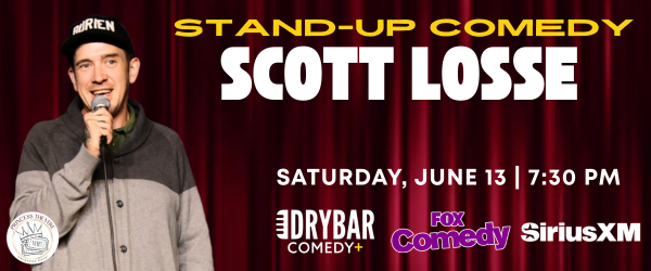 Stand-up comedian Scott Losse on red curtain stage