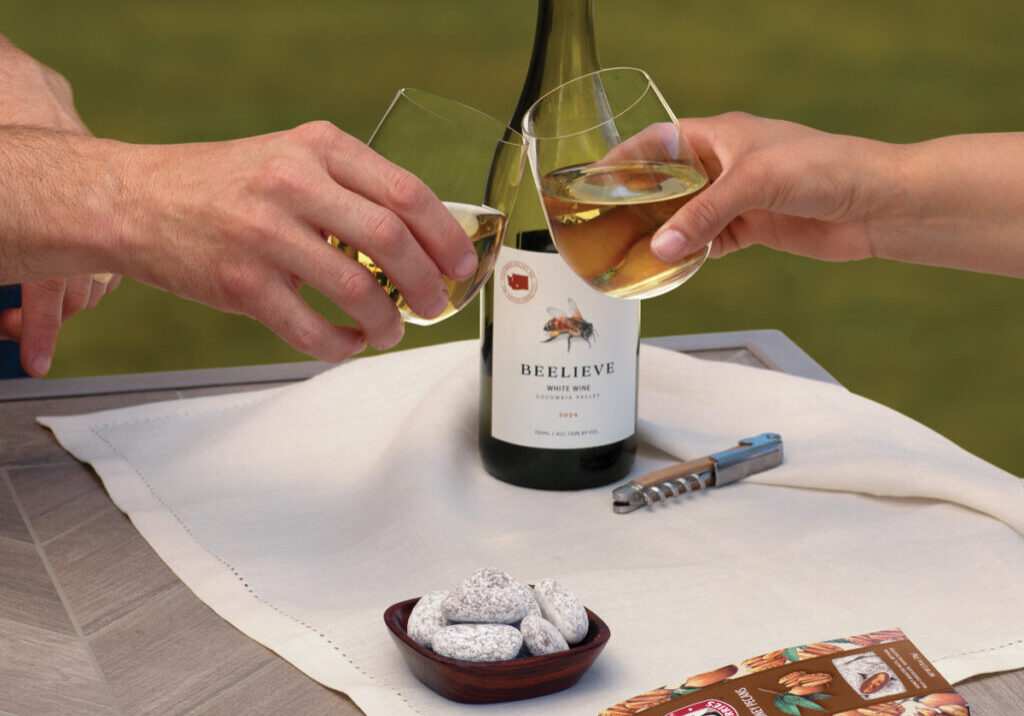 Wine glasses clinking over a table setup.