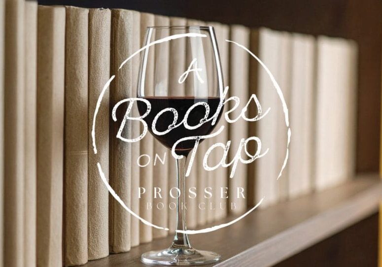 Wine glass in front of a bookshelf.