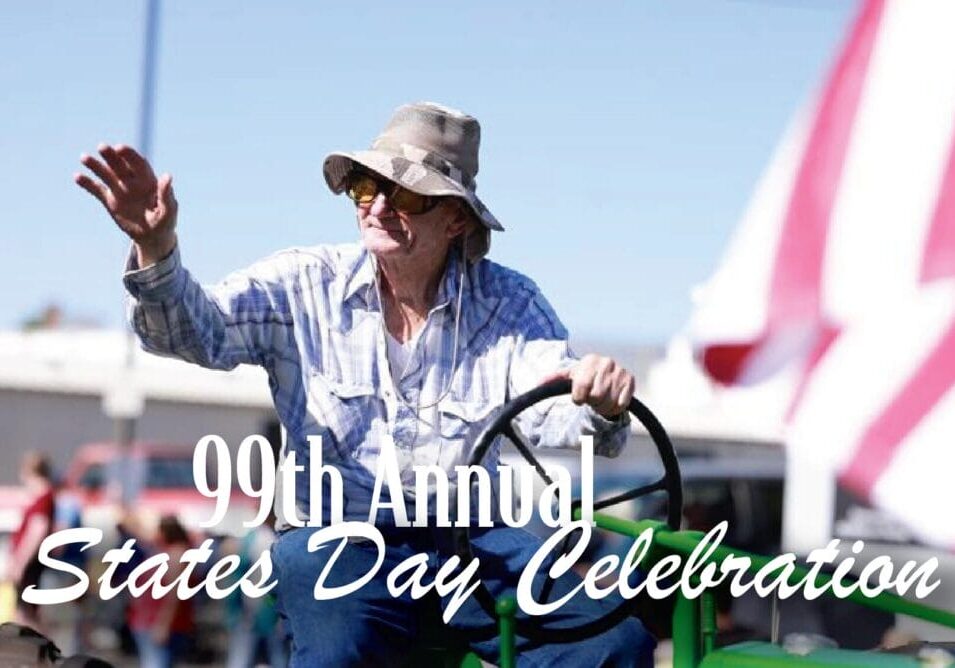 99th States Day Celebration parade participant waving