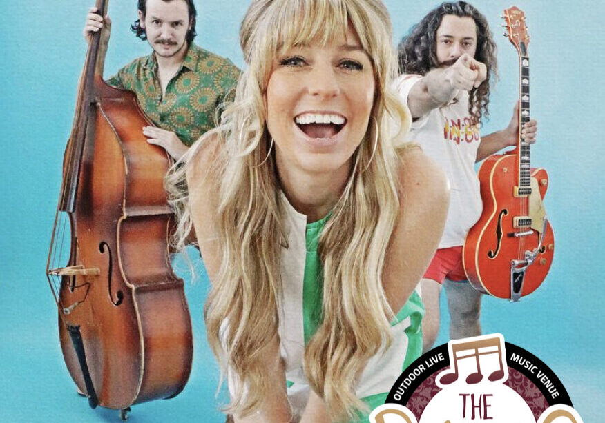 Three musicians posing with upright bass and guitar