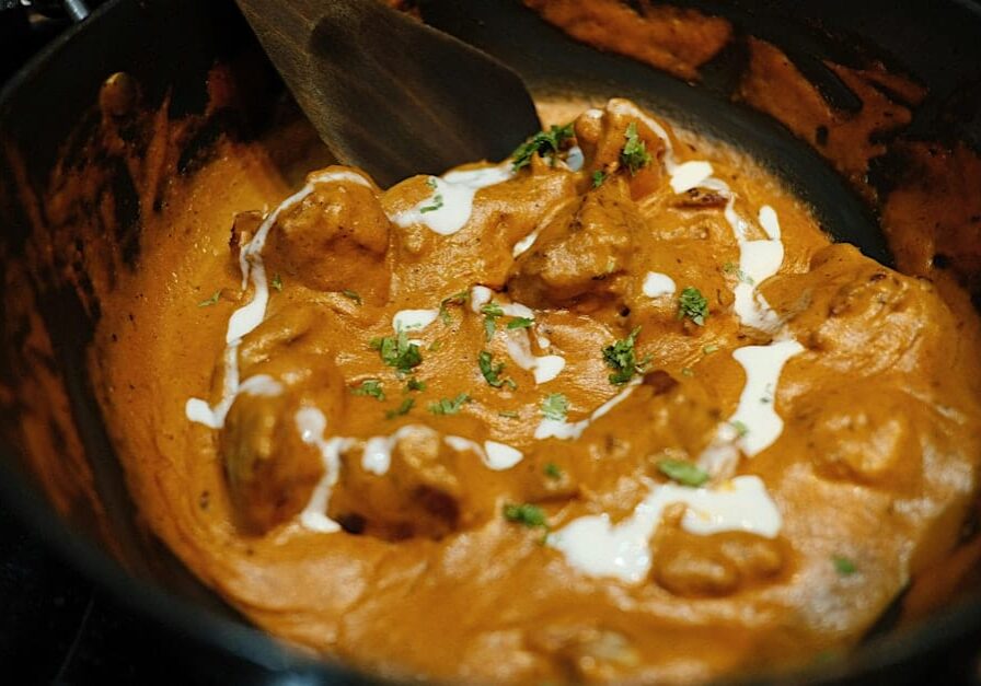 Creamy butter chicken in a pot